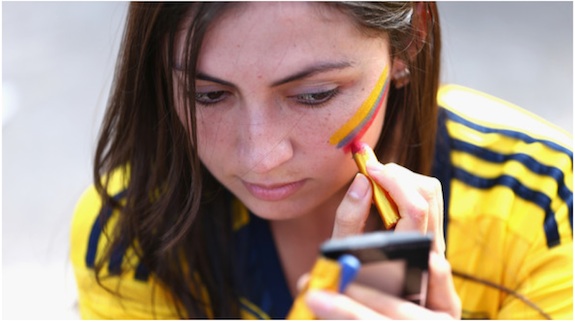 A Colombia fan paints her face prior to the 2014 FIFA World Cup Brazil Group C match between Colombia and Greece at Estadio Mineirao on June 14, 2014 in Belo Horizonte, Brazil.
