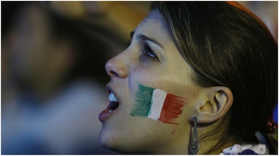 A Italian soccer fan watches a live broadcast of the World Cup match between England and Italy, inside the FIFA Fan Fest area on Copacabana beach, in Rio de Janeiro, Brazil, Saturday, June 14, 2014. Italy defeated England 2-1 in a group D match of the Soccer World Cup.