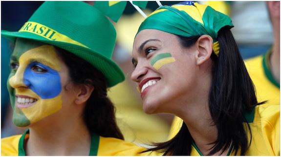 Brazil fans attend the opening ceremony of the World Cup before the group A match between Brazil and Croatia, the opening game of the tournament, in the Itaquerao Stadium in Sao Paulo, Brazil, Thursday, June 12, 2014. 