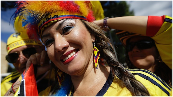 A Columbian fan has her headgear adjusted before the group C World Cup soccer match between Colombia and Greece at the Mineirao Stadium in Belo Horizonte, Brazil, Saturday, June 14, 2014. 
